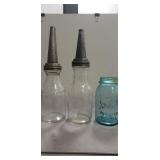 (2) Vintage Glass Motor Oil Bottles w/ Metal