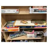 Shelf Lot Of Puzzles, Rockwell Prints, B & W