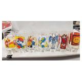 (7) Assorted Collector Glasses (Snoopy, Smurf &