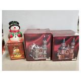 (2) Lighted Porcelain Buildings & (1) Snowman