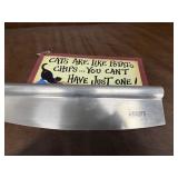 Large pizza cutter and sign