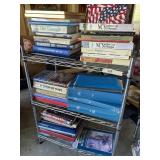Two shelves and books/speaker