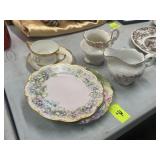 Two plates, saucers, creamer and tea set