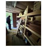 Wood on shelves in container