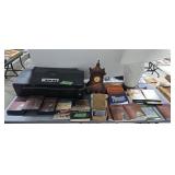 Books DVDS lamp printer guitar case under table
