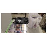 Lots of DVDs and leather carry bag