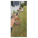 Lot Of Flower Pots Located In Backyard
