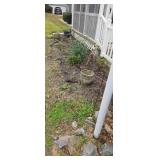 Items In Front Flower Bed Flower Pots And Hose