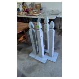 Five wooden stanchions