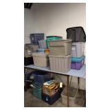 Lots Of Plastic Storage Totes On Top Of Table