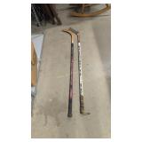 Pair of hockey sticks one is autographed