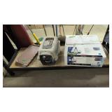 Modern Chandelier In The Box And Cat Carrier