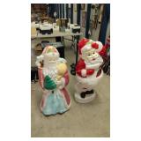 Pair of vintage outdoor Santa Claus figures one