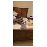 Lot Of Linens On Bed