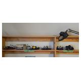 Lot Of Fishing Reels On Top Of Workbench