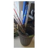 Lot Of Fishing Rods And Blue Fishing Rod Carriers