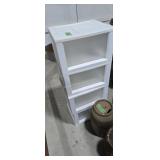 Four plastic storage bins