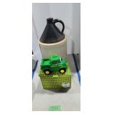 Antique 6 gallon handled jug with John Deere toy