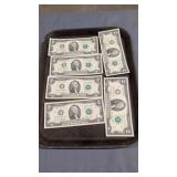 Six $2 bills as shown