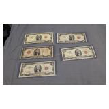 Five red seal $2 bills