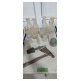 Vintage bottles insulator and hatchet