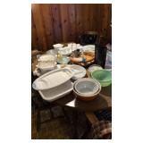 Lot of CorningWare set of Corelle china on table