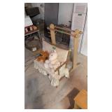 Quilt rack with child's bench and stuffed animals