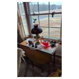 Glassware small cradle figurines in window brass