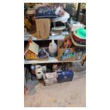 Items on top and underneath the picnic table oil