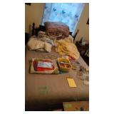 Blankets jewelry etc on top of bed