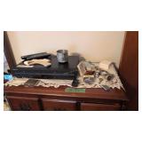 Items on top of dresser Sony DVD player watches