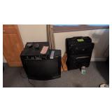 Suitcase TV linens in closet