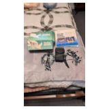 Vivitar camera horseshoes hair dryer items on bed