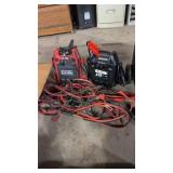 Two Jump Boxes And Jumper Cables