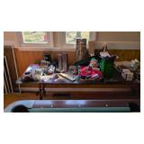 Items on table keyboard VHS tapes speakers etc