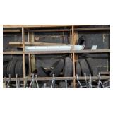 Tires And Light Fixtures On Wooden Wall Rack