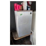 Two Refrigerators And Table