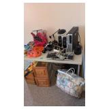 Computer items on table and underneath table as