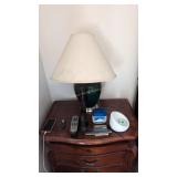 Table lamp flashlights on top of nightstand