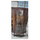 Antique oak bow front China closet with claw feet