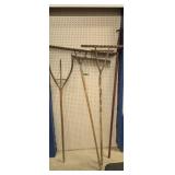 Antique wooden rakes and boat hook