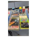 Vintage thermos bottles and magazines as shown
