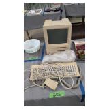 Vintage Apple computer with keyboard