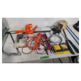 Electric hedge trimmers saw trouble light twine