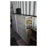 Two lateral file cabinets and items on top