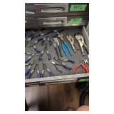 Lots of needle-nose pliers vice grips pliers etc