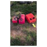 Three boat motor gas cans