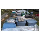 Lot of plastic tubs containing household items,