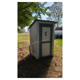 Vintage outhouse with contents
