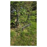 Metal porch swing located in backyard